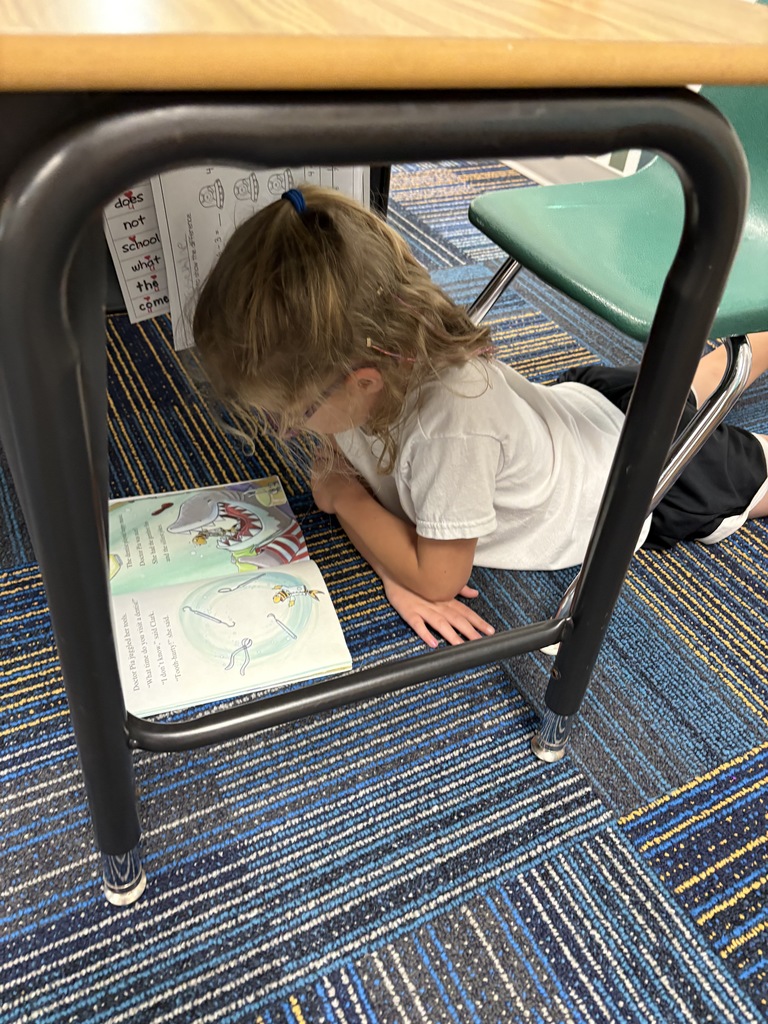 reading under a desk