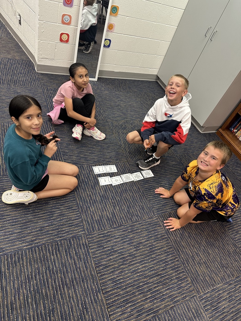 Students distinguishing between fact & opinion.