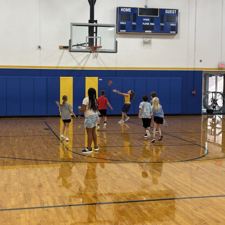 students playing football in the gym