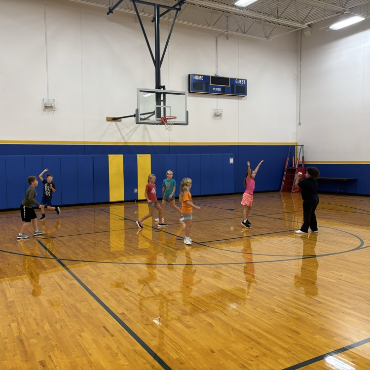 students playing football in the gym