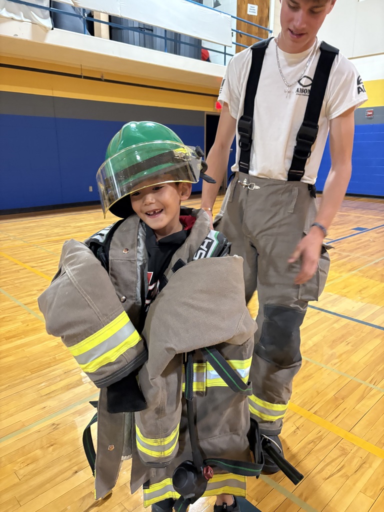 trying on fire fighters uniform