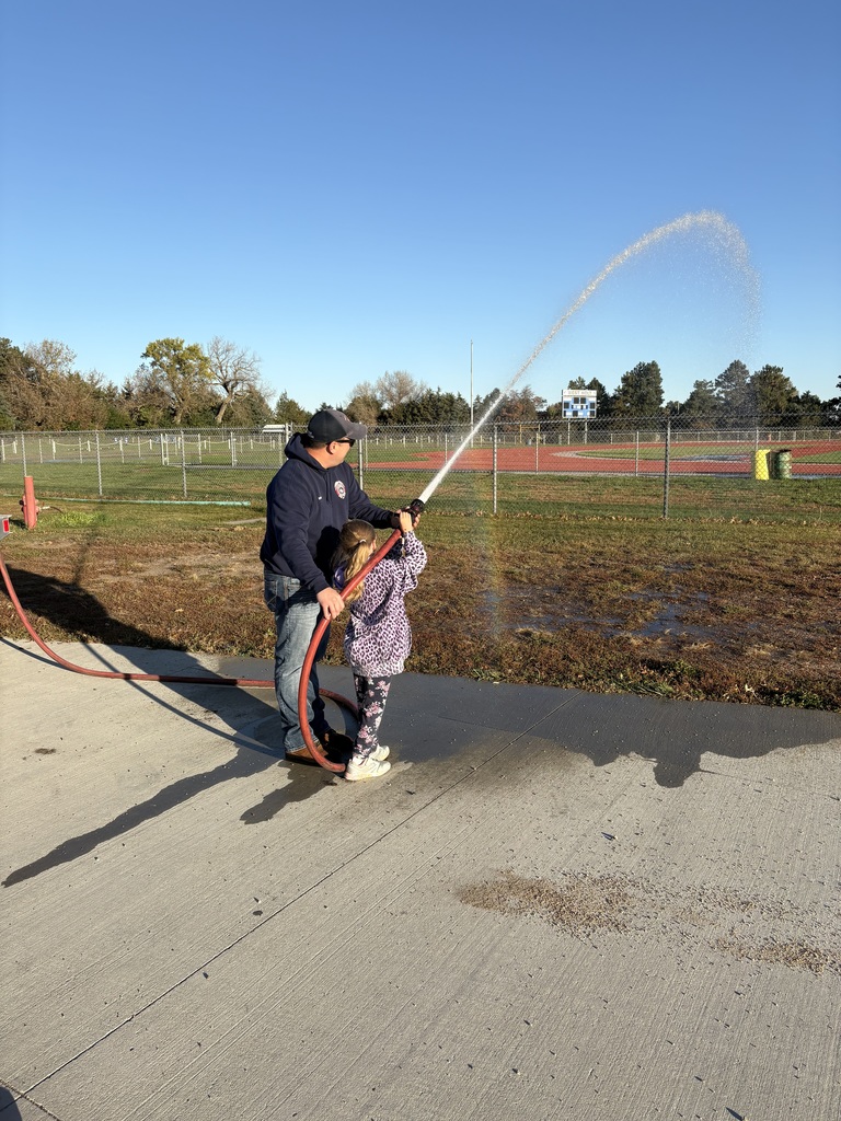spraying a fire hose