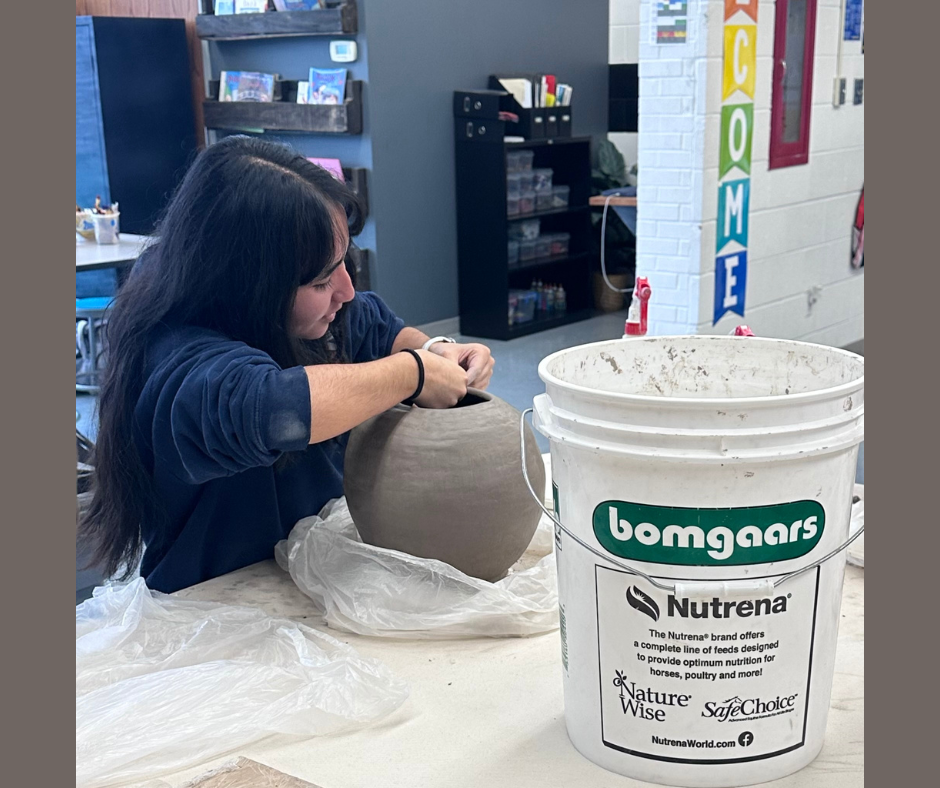 Jocelyn working on her pottery.
