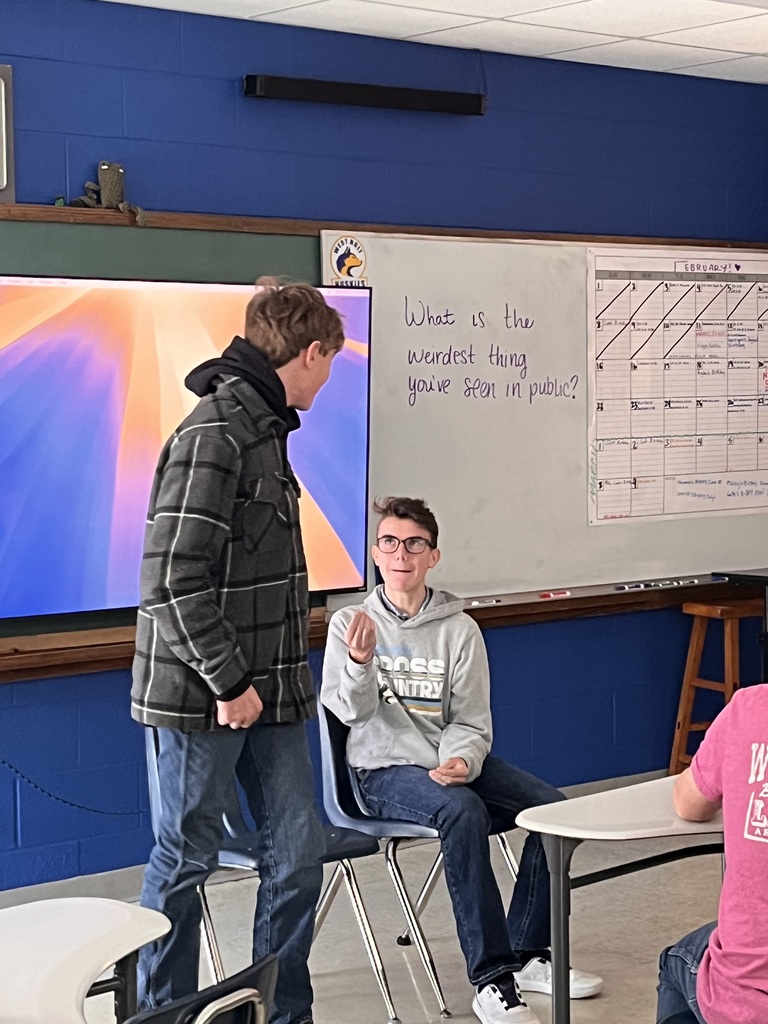 Two junior high boys playing an improv game. 
