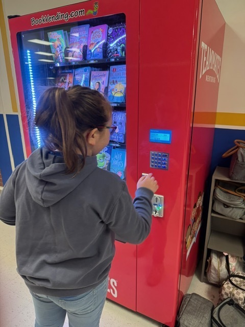 Choosing a book from the Book Vending Machine.