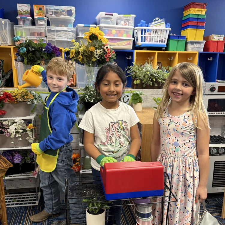 Students engaged in learning via play.