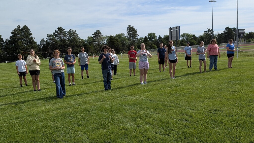 Some of the band members in a parade block on the discus field