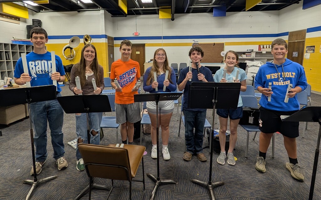High School Band members holding their hand chimes for the Star Spangled Banner