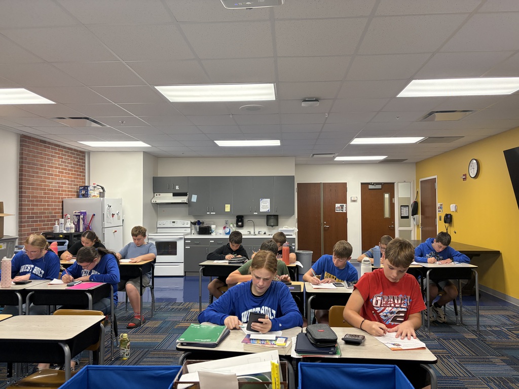 7th Grade math students working hard on "Taxes and Gratuities".