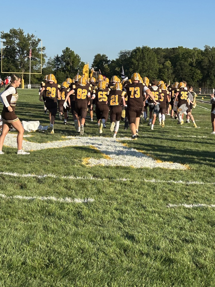 football team running in field