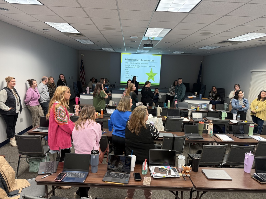 teachers colloborating and standing