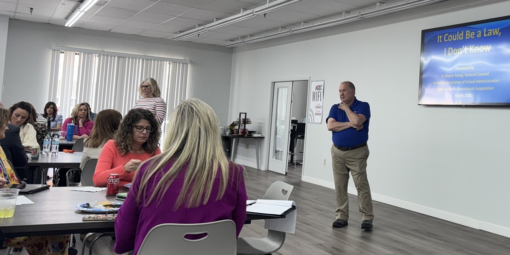 wayne young speaking to a group of people in a conference room