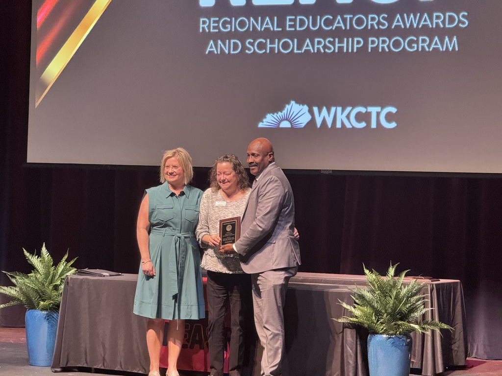susan beatty accepting an award on stage at WKCTC