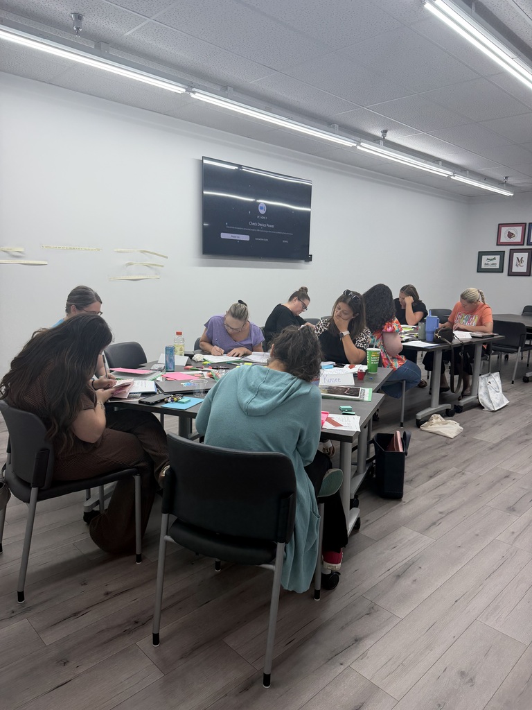 people standing in a room collaborating