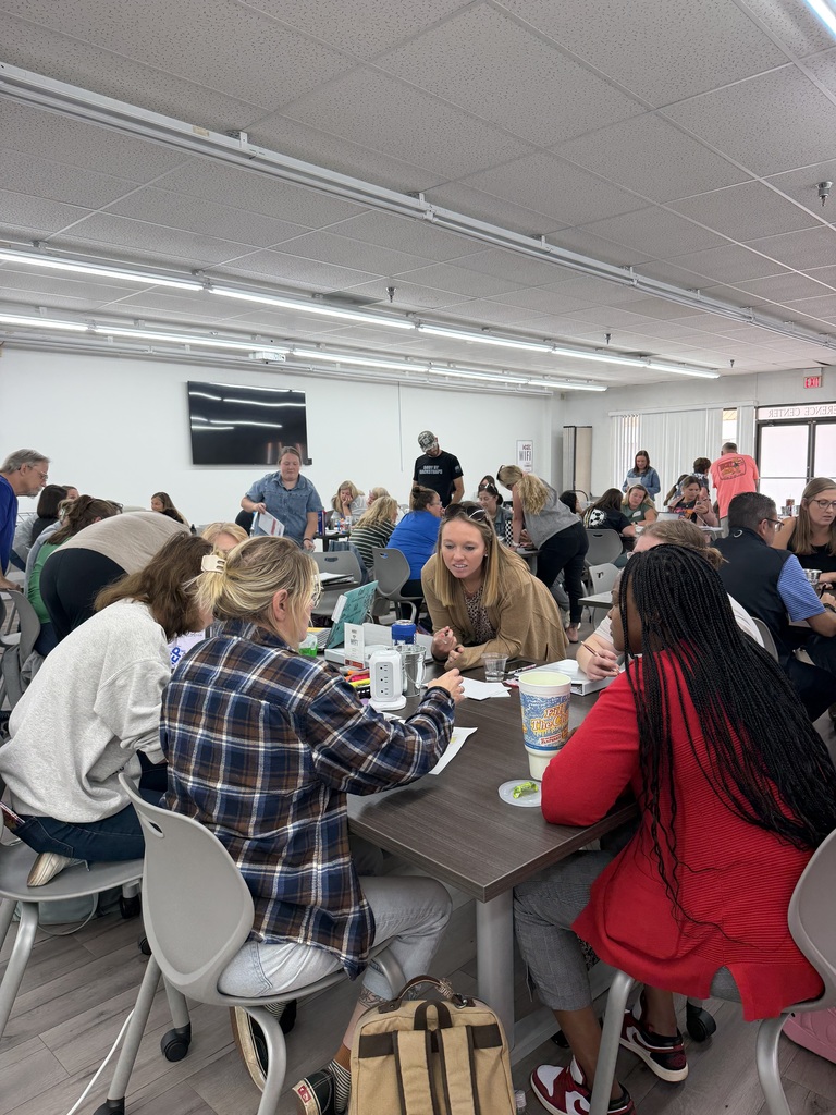 people standing in a room collaborating