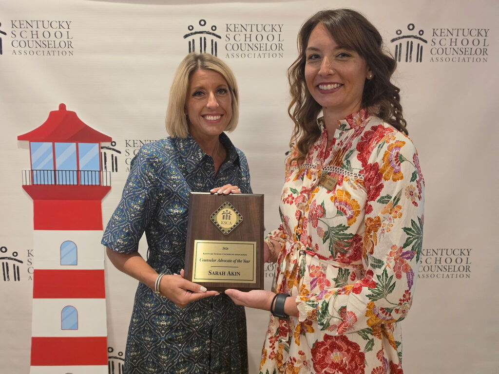 sarah akin receiving an award
