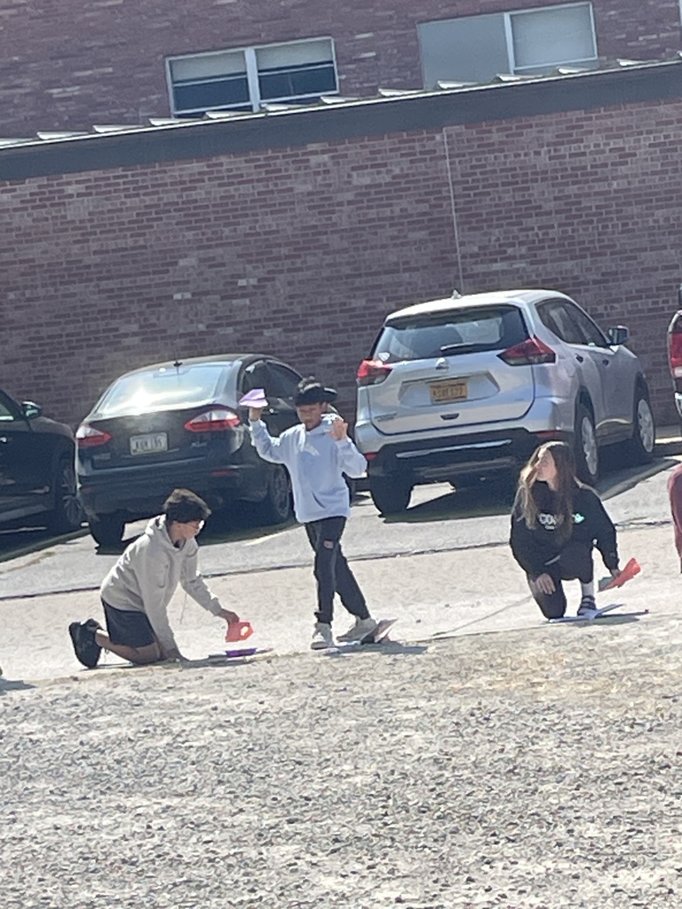 8th graders testing their paper airplane designs in science!