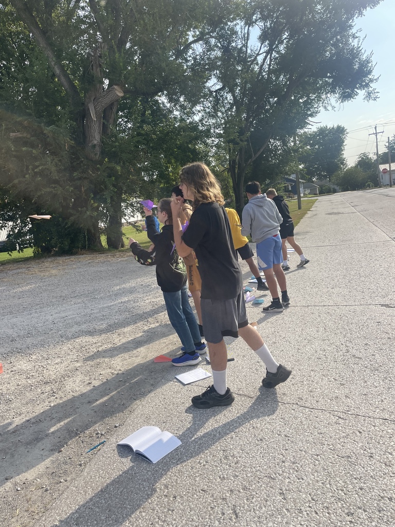 8th graders testing their paper airplane designs in science!