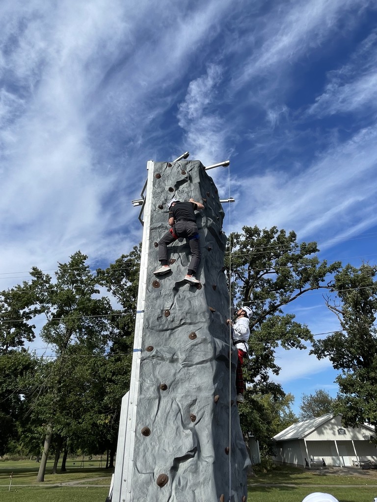 Mr. Weidenaar on the rock climbing wall