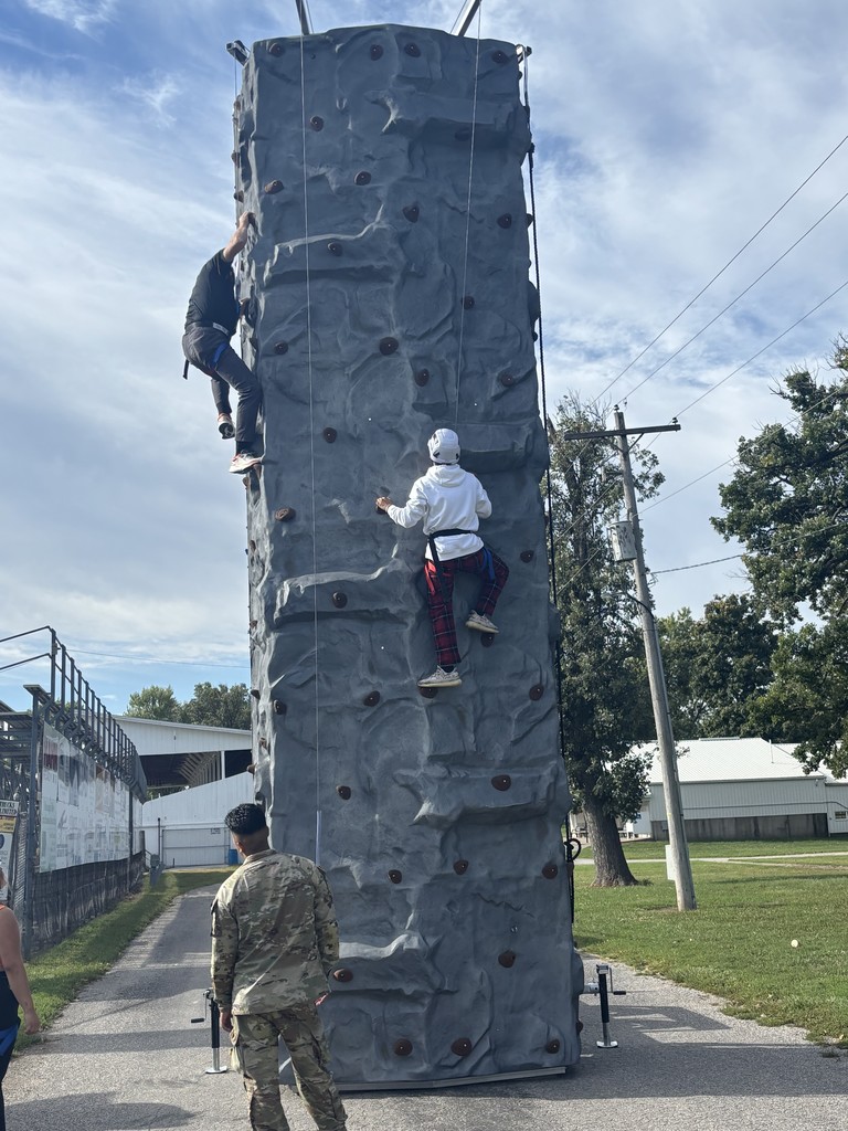 Mr. Weidenaar on the rock climbing wall