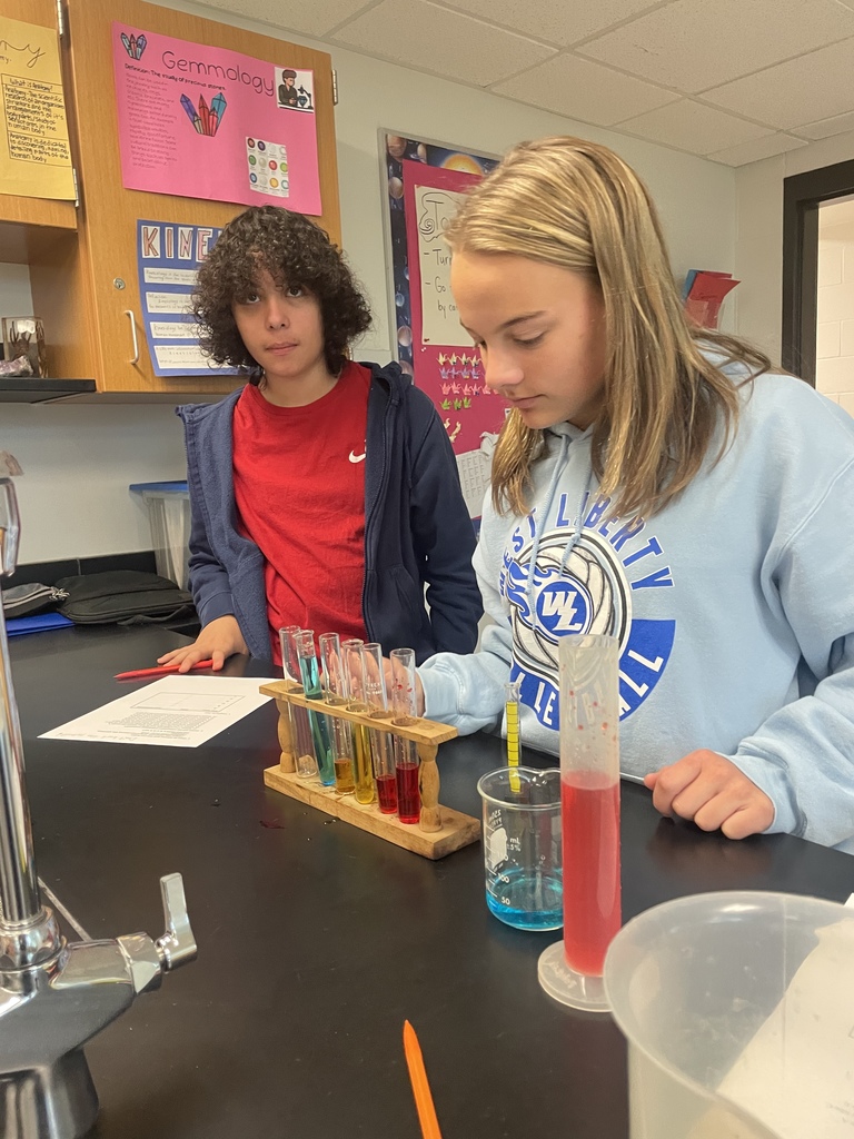 8th graders working on following procedures and making accurate measurements in science!