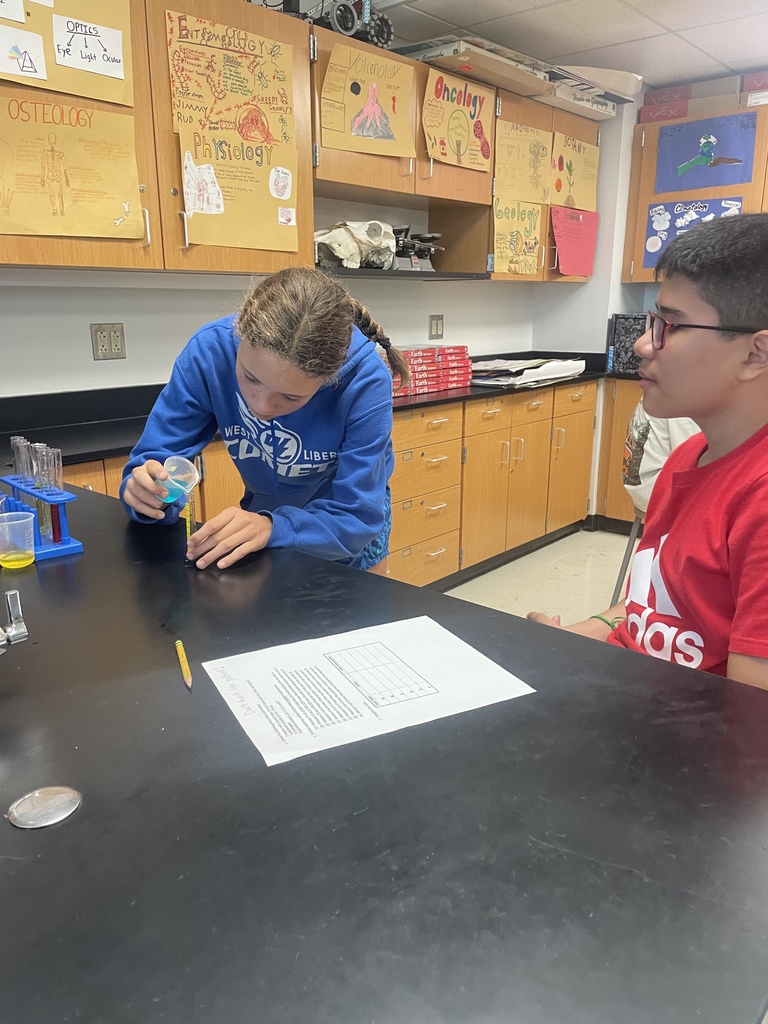 8th graders working on following procedures and making accurate measurements in science!