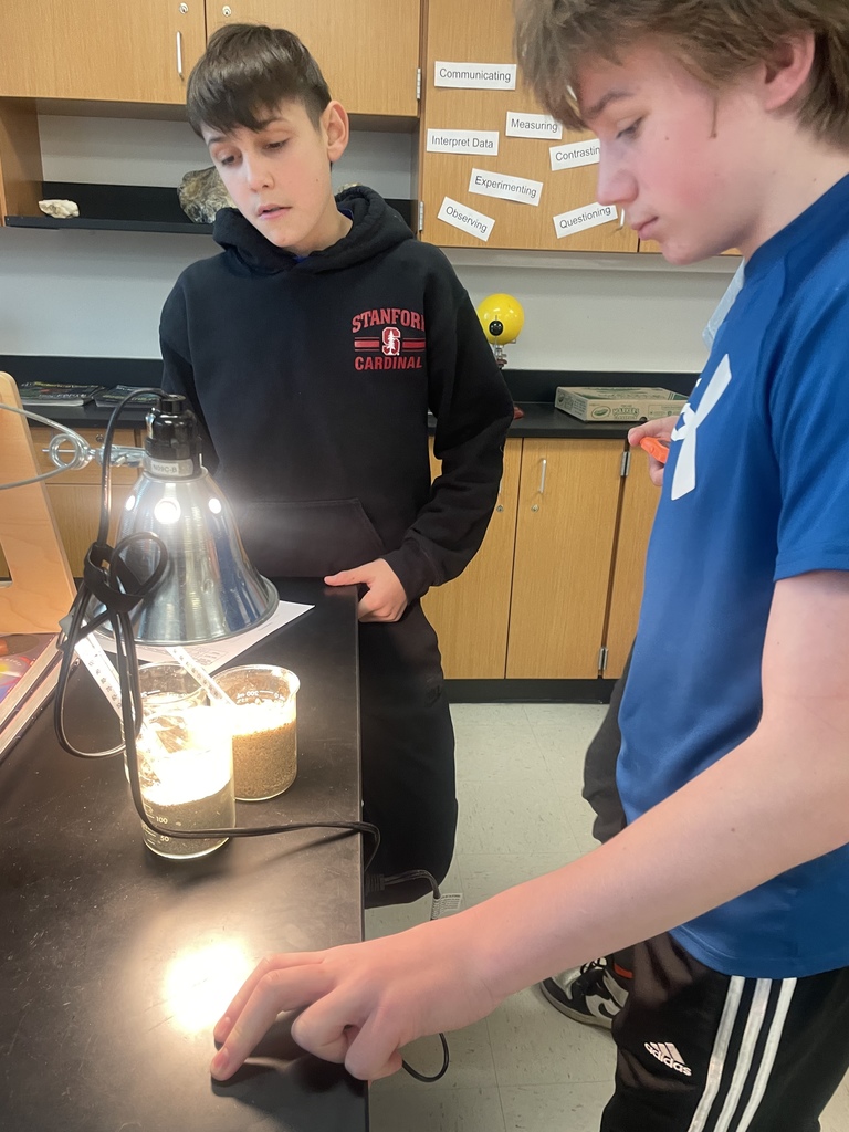 8th grade has skills! Science students are determining the specific heat of water and sand by measuring, observing, graphing, and analyzing data.