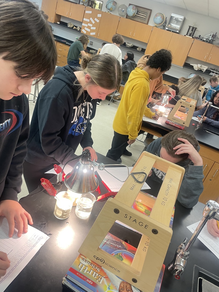8th grade has skills! Science students are determining the specific heat of water and sand by measuring, observing, graphing, and analyzing data.
