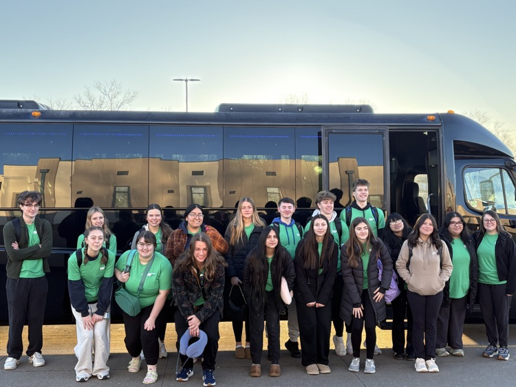 2026 WLHS students and chaperones standing in front of the bus before boarding to travel to China
