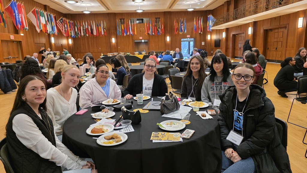 WLHS Educators Rising Members seated at their table for the 3rd annual state conference at the University of Iowa