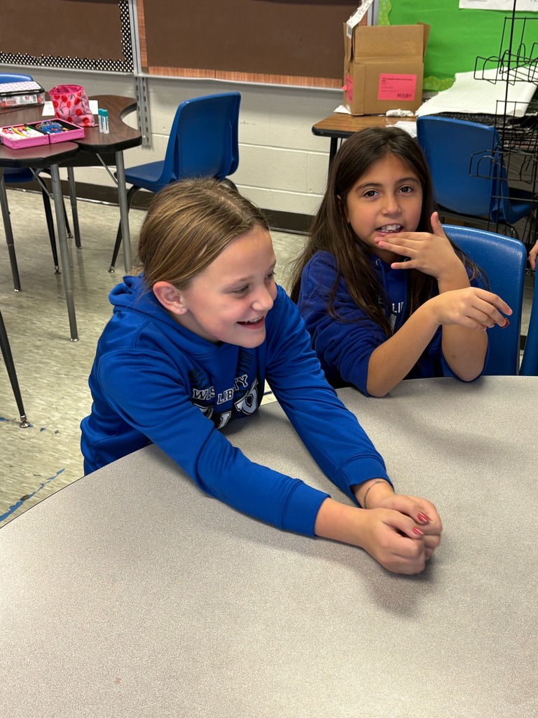 Elementary students interacting with FFA members