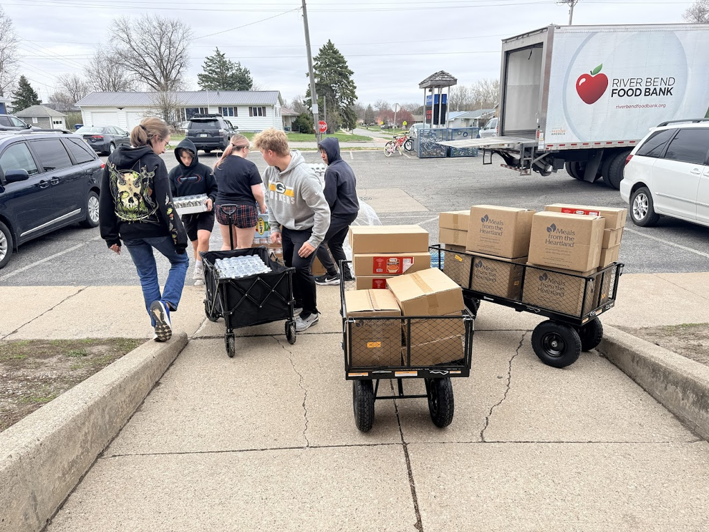 Students are putting in hard work by helping with the Backpack Program at the middle school!