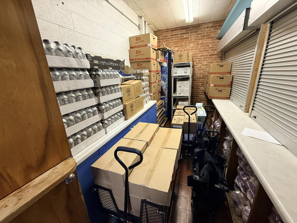 Students are putting in hard work by helping with the Backpack Program at the middle school!