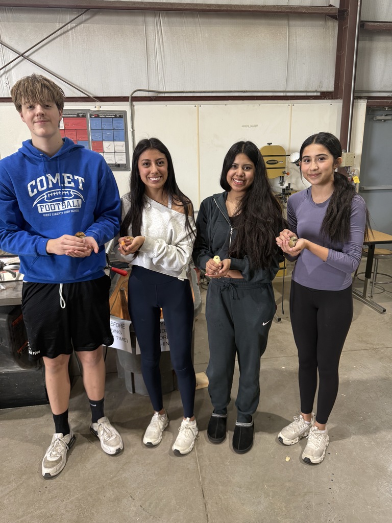 4 students holding baby chicks