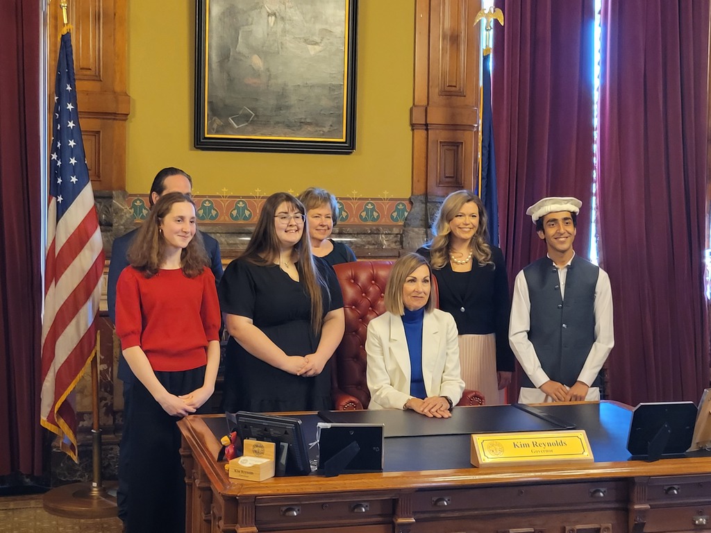 Georgia with other winners at the govenors desk. 