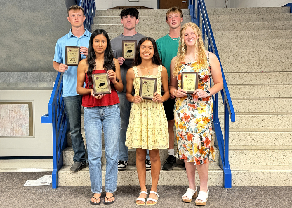 six athletes with their award plaques, standing three and three