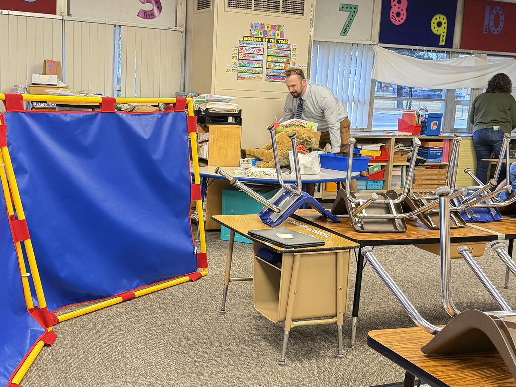 Joel moving stuff in the functional skills classroom