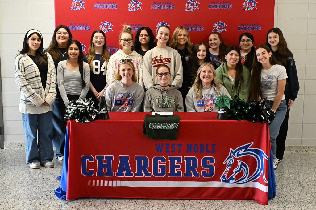 bella barnes at her college signing with friends