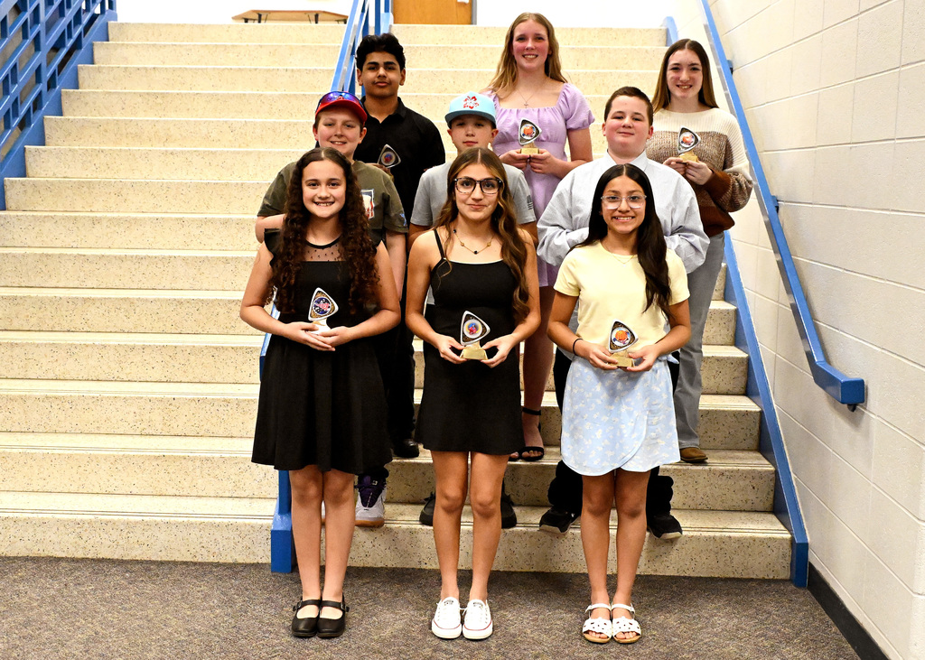 charger strong award winners posing with trophies