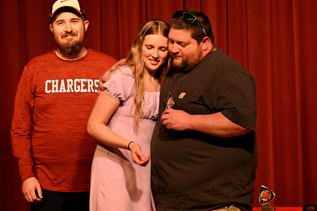 ellie davidsen getting a hug from coach