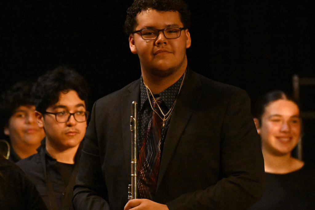 a west noble high school band member posing with his instrument
