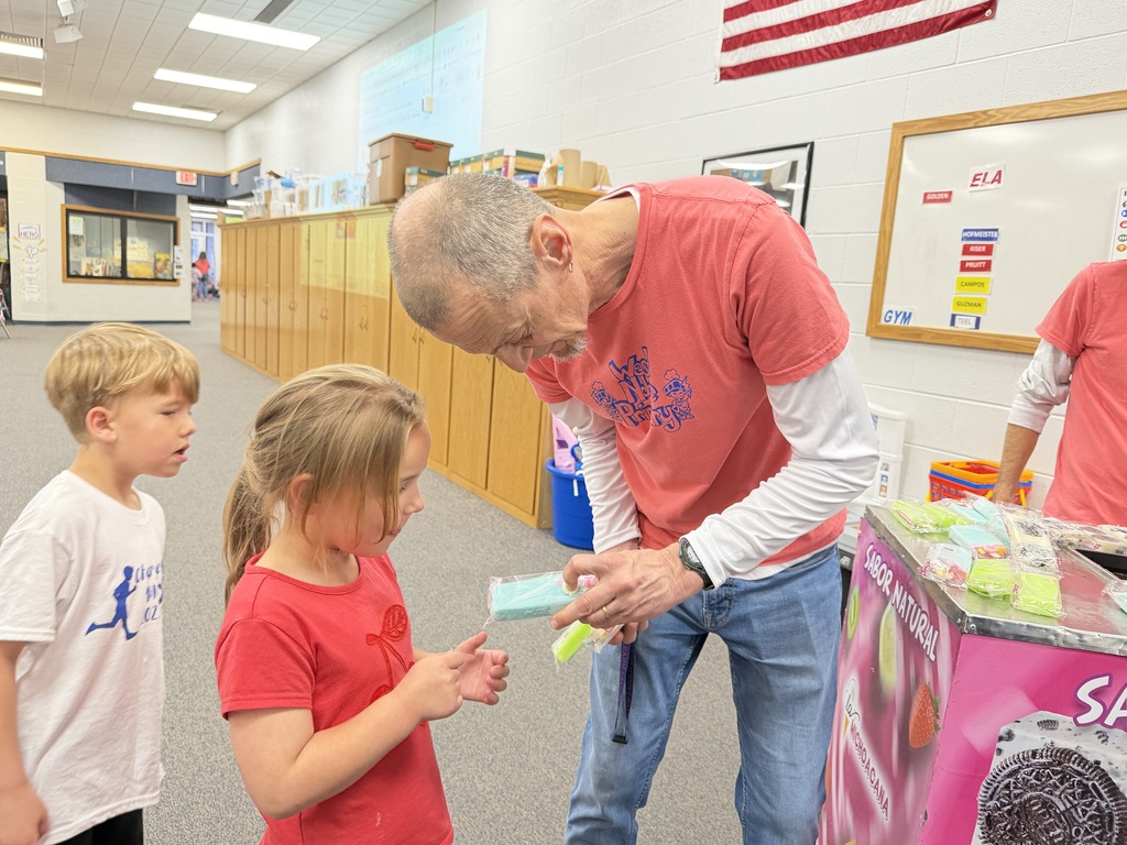 brian shepherd passing out popsicles to students