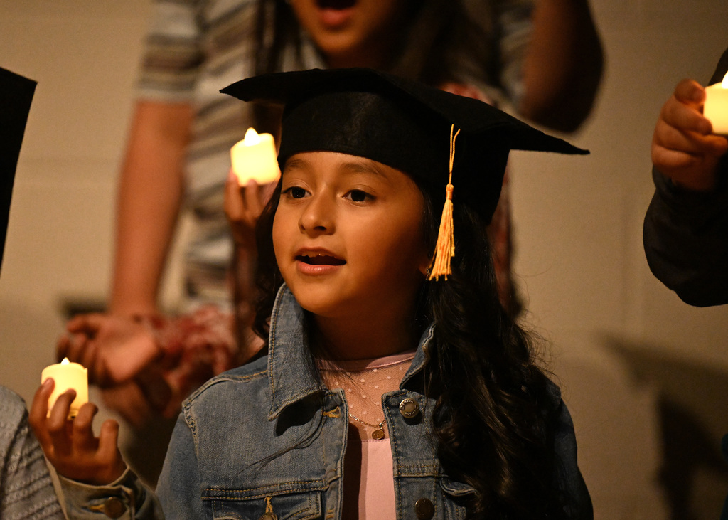 students singing at graduation