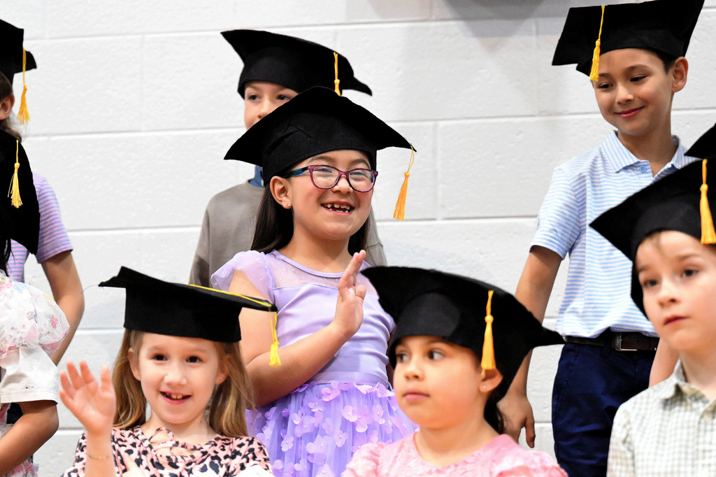 students singing at graduation