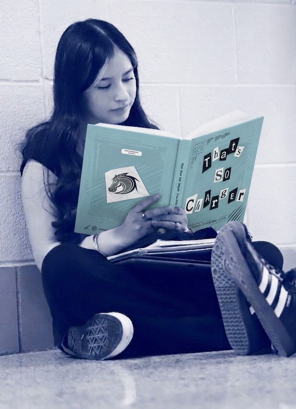 a girl reading a yearbook