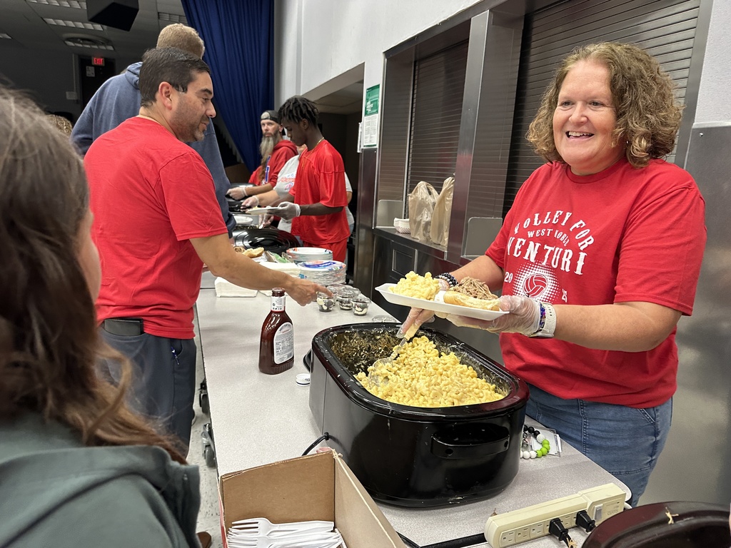 lady serving food to someone