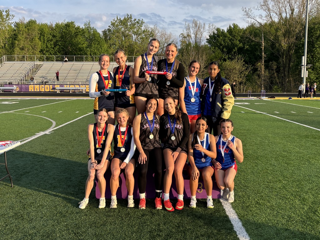 12 girls on a podium at a track meet