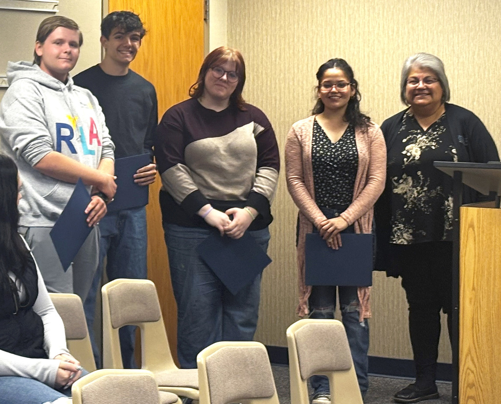 five people at the school board meeting being recognized as part of RYLA Noble County