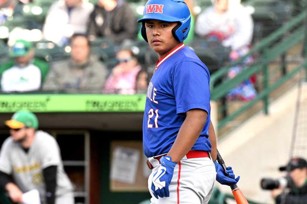 baseball batter looking at his coach