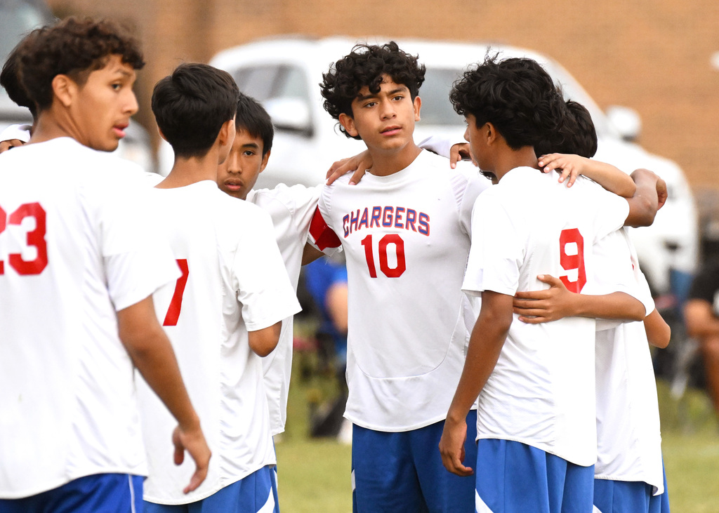 boys soccer players in a huddle